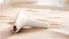A Philips Lumea hair removal device is placed on a textured, light-colored fabric surface. Náhled obrázku produktu