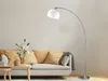 A modern living room scene with a sofa, coffee table, and a floor lamp. Produktbild-Vorschau