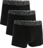 Three black boxer shorts are arranged in a staggered formation against a white background. Náhled obrázku produktu