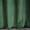 A close-up view of a dark green velvet curtain, showing its texture and folds. Produktbild-Vorschau