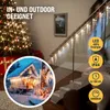 A festive scene with Christmas lights on a tree and a house, and icicle lights on a staircase railing. Produktbild-Vorschau