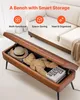 A brown storage bench is open, revealing items inside, with a sofa in the background and marketing text overlays. Náhľad obrázku produktu