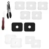 A collection of kitchen tools and accessories, including tongs, a paring knife, and several square-shaped items with circular cutouts. Anteprima dell’immagine prodotto