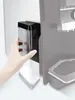 A hand is shown inserting a milk container into a coffee machine. Anteprima dell’immagine prodotto