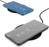Two smartphone cases are shown, one blue and one gray, both placed on black wireless charging pads. Produktbild-Vorschau