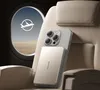 A power bank attached to a smartphone, placed on an airplane seat next to the window. Produktbild-Vorschau
