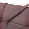 A close-up view of a brown fabric bag with straps. Produktbild-Vorschau