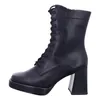 A black leather lace-up boot with a platform sole and block heel, shown from the side against a white background. Produktbild-Vorschau