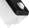 A close-up view of the bottom corner of a white and black electronic device, possibly a heater, showing a white dial and a small white button. Produktbild-Vorschau