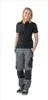 A woman is standing and posing for a product photo. Produktbild-Vorschau