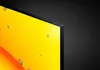 Close-up of the corner of a television screen displaying a bright yellow image with water droplets. Produktbild-Vorschau
