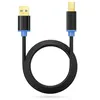A black USB cable with gold-plated connectors and blue accents, coiled on a white background. Produktbild-Vorschau