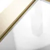 A close-up view of a shower enclosure frame with a brushed gold finish and a beige interior panel. Anteprima dell’immagine prodotto