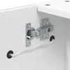 A close-up view of a white cabinet hinge with a white LED strip cable running through a black grommet. Produktbild-Vorschau