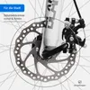 Close-up of a bicycle's disc brake system, highlighting the brake rotor and caliper. Produktbild-Vorschau