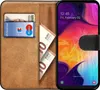 A book-style phone case with a Samsung Galaxy A10 phone inside, showing cards and banknotes in the case. Produktbild-Vorschau