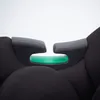 A close-up view of a black car seat with a green accent. Produktbild-Vorschau