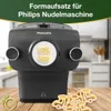 A pasta maker attachment for a Philips Nudelmaschine with pasta shapes in the foreground. Podgląd zdjęcia produktu