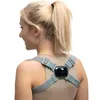 A woman wearing a posture corrector device on her back. Podgląd zdjęcia produktu
