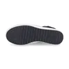 The underside of a black shoe is shown against a white background. Voir les images du produit
