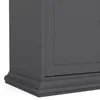 A close-up view of the bottom corner of a gray sideboard. Produktbild-Vorschau