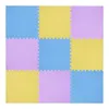 A top-down view of a 3x3 grid of interlocking foam puzzle mats in blue, yellow, and purple. Voir les images du produit