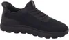 A black athletic shoe is shown from the side against a white background. Voir les images du produit