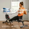 A woman is using a rowing machine in a well-lit room with a window in the background. Produktbild-Vorschau