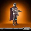 A Star Wars Vintage Collection The Mandalorian Beskar action figure is shown against an orange gradient background. Produktbild-Vorschau
