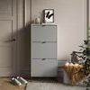 A hallway or entryway scene with a shoe cabinet, door, and seating. Anteprima dell’immagine prodotto