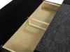Close-up view of the open storage compartment of a sofa, showing wooden dividers. Náhľad obrázku produktu
