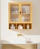 A wooden bathroom cabinet with glass doors above a sink. Voir les images du produit