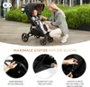 A woman is kneeling next to a stroller with a child in it, on a wooden deck with greenery in the background. Below are close-up images of stroller features. Produktbild-Vorschau