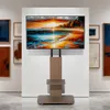 A TV stand with a TV displaying a landscape painting, set in what appears to be an art gallery. Anteprima dell’immagine prodotto