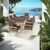 An outdoor dining set on a patio overlooking the ocean. Náhled obrázku produktu