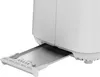 A close-up view of the bottom part of a white toaster, showing the crumb tray extended. Voir les images du produit