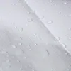 A close-up view of a white tarp with water droplets on its surface. Produktbild-Vorschau