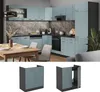 A modern kitchen with light blue-gray cabinets and dark gray countertops, featuring a dining table and chairs in the foreground, and two separate cabinet modules shown below. Produktbild-Vorschau