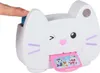 A finger presses a blue button on a white cat-shaped toy camera. Produktbild-Vorschau