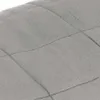 A close-up view of a quilted gray fabric, likely a blanket or similar textile product. Podgląd zdjęcia produktu