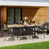 An outdoor dining set with a table and chairs on a patio. Produktbild-Vorschau