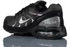 A black Nike Air Max Torch 4 sneaker with silver accents is shown from the side against a white background. Voir les images du produit