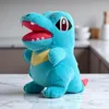 A blue plush toy of a Pokemon character is displayed on a marble-like surface in what appears to be a kitchen setting. Produktbild-Vorschau