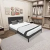 A bedroom with a bed, closet, and wall art. Produktbild-Vorschau