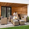 A couple relaxing on a patio with a polyrattan lounge set. Produktbild-Vorschau