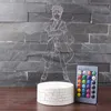 A 3D LED lamp featuring a Naruto character, with a remote control, displayed on a wooden surface against a stone wall. Produktbild-Vorschau