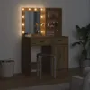 A vanity table with LED lights and a stool in a dimly lit room. Náhľad obrázku produktu