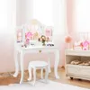 A child's white vanity table and stool with a tri-fold mirror, set in a room with pink curtains and a white rug. Podgląd zdjęcia produktu