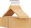 A stack of wooden hangers against a white background. Produktbild-Vorschau