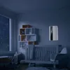 A nursery room at night with a crib, shelves, and a window showing stars. Náhled obrázku produktu